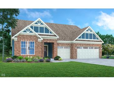 Charming brick home featuring a two-car garage, well-kept lawn and architectural roof with stylish gable windows at 9352 Corbett Dr, McCordsville, IN 46055