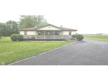 Charming single-story home featuring a welcoming front porch and well-maintained lawn at 3107 N 100 W, Shelbyville, IN 46176