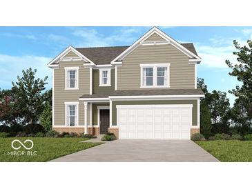 This is a charming two-story home with a two car garage, a combination of brick and vinyl siding, and manicured lawn at 438 Weaver Ln, Pittsboro, IN 46167