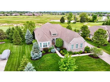 Beautiful single-Gathering home featuring a well-manicured lawn and lush landscaping at 4420 Hickory Ridge Blvd, Greenwood, IN 46143