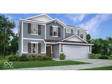 Charming two-story home with stone accents, gray siding, white trim, and a two-car garage at 8784 Alexander Ridge Dr, McCordsville, IN 46055