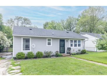 Charming single-story home with a well-manicured lawn and neatly trimmed shrubbery at 305 W Vinyard St, Anderson, IN 46011