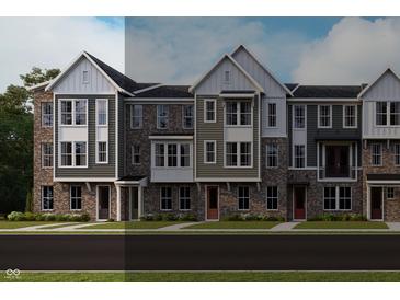 New townhome row with brick and vinyl siding, multi-pane windows, and contrasting trim at 412 Elite St # 2-601, Westfield, IN 46074