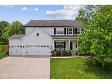 Charming two-story home featuring a three-car garage and a well-maintained lawn at 4681 Shelby Cir, Greenwood, IN 46143