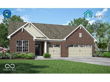 Charming brick home with a well-manicured lawn and a two-car garage at 9351 Abner St, McCordsville, IN 46055
