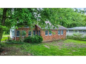 Charming brick home with mature trees, offering a serene setting and classic appeal at 6580 N Us Highway 31, Whiteland, IN 46184