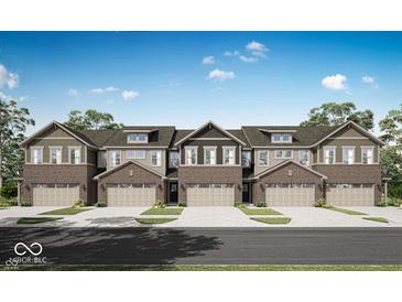 New brick townhomes featuring well-manicured lawns, two-car garages, and attractive architectural details at 6675 Halsey St, Zionsville, IN 46077