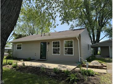 Charming one-story home with a well-maintained lawn and landscaping, creating a welcoming curb appeal at 409 Parkway St, Whiteland, IN 46184