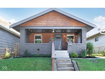 Charming craftsman-style home featuring a covered porch and a wood-accented gable at 1421 S New Jersey St, Indianapolis, IN 46225