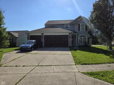 Charming two-story home with a spacious driveway and well-maintained landscaping in a suburban neighborhood at 2248 Salem Park Dr, Indianapolis, IN 46239