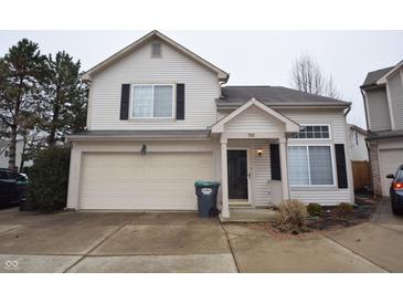 Two story home with neutral siding, two car garage and black shutters at 708 Mountain Pine Dr, Greenwood, IN 46143