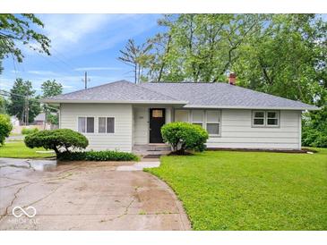 Charming one-story home with a well-manicured lawn and inviting curb appeal at 2105 Mayfair Dr, Indianapolis, IN 46260