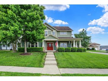 Charming two-story home with a manicured lawn and inviting red front door at 241 Liberty Blvd, Mooresville, IN 46158