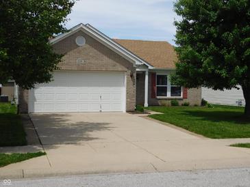 Charming single-Gathering home with brick facade, attached garage, and well-maintained lawn at 8346 Weathervane Cir, Indianapolis, IN 46239
