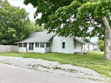 Charming single-story home with a well-maintained lawn and lush greenery, perfect for comfortable living at 106 S Hancock St, Waynetown, IN 47990