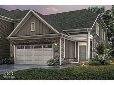 Charming home featuring a stone facade, attached two-car garage, and well-manicured lawn at 14878 E Keenan Cir # Lot 37, Westfield, IN 46074