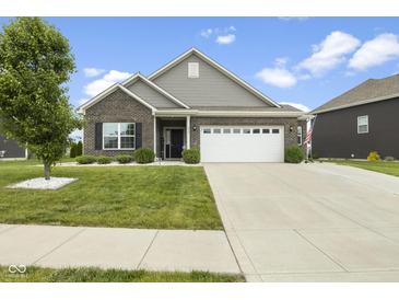 Charming single-story home with brick and siding, a two-car garage, and a well-manicured lawn at 998 Cherry Tree Ln, Greenwood, IN 46143