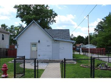 Charming one story home featuring white siding and a well-maintained front yard at 202 S Church St, Brooklyn, IN 46111