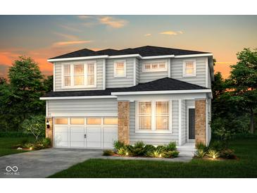 Charming two-story home featuring a two-car garage and stone accents at 6761 Seabiscuit Rd, Whitestown, IN 46075