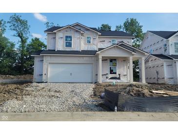 Unfinished two-story home with attached garage and covered entry offers a glimpse of future possibilities at 6849 Seabiscuit Rd, Whitestown, IN 46075