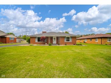 Charming brick ranch home with a well-maintained lawn and inviting front entrance at 105 Golf Club Rd, Anderson, IN 46011