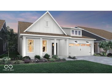 Charming single-Gathering home showcasing white siding, black accents, well-manicured lawn, and a welcoming two-car garage at 19348 Mcbee Ave, Westfield, IN 46074
