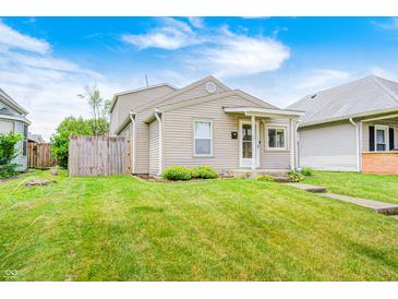Charming single-Gathering home featuring a well-maintained lawn and a cozy, inviting front porch at 148 S 3Rd Ave, Beech Grove, IN 46107