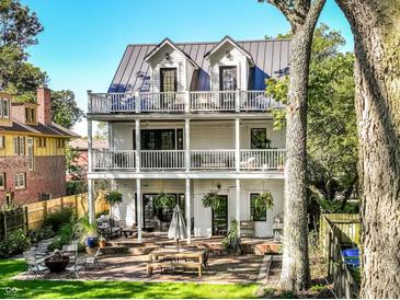 Charming three-story home with a spacious outdoor patio and balcony on each level, perfect for entertaining at 3215 N Pennsylvania St, Indianapolis, IN 46205