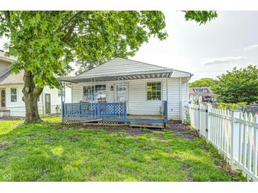 Charming single-story home with blue front porch and white picket fence at 2840 Denison St, Indianapolis, IN 46241