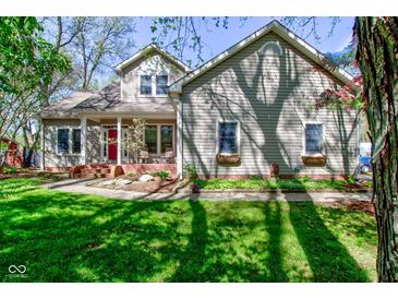Charming two-story home featuring a welcoming front porch and well-manicured lawn at 3533 Alexandria Pike, Anderson, IN 46012