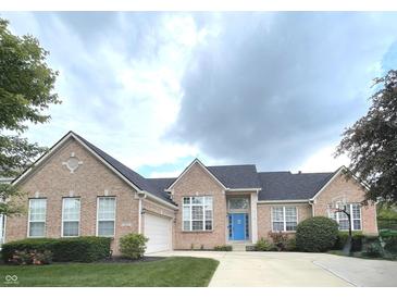 Charming brick home with a well-manicured lawn, driveway and basketball hoop at 5010 Cabrillo Dr, Plainfield, IN 46168