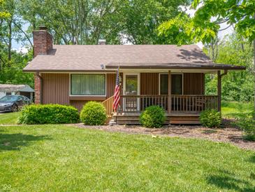 Charming single-story home with a covered front porch and well-maintained lawn at 10307 Wilson Rd, Brownsburg, IN 46112
