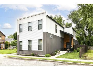 Contemporary two-story home showcases a well-manicured lawn and a modern, two-tone facade at 1620 W New York St, Indianapolis, IN 46222