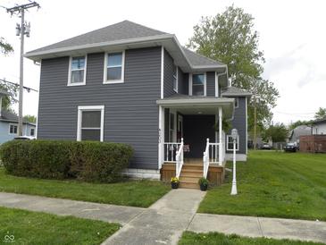 Charming two-story home with well-maintained landscaping and inviting front porch at 203 W 3Rd St, Sheridan, IN 46069