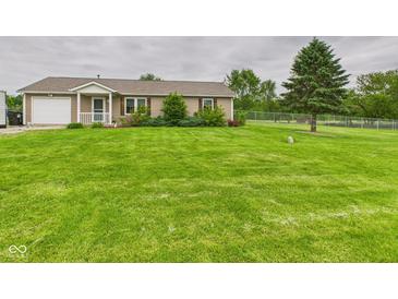 Ranch-style home boasting a well-manicured lawn, inviting curb appeal, and a one-car garage at 3387 S County Road 250 W, Danville, IN 46122