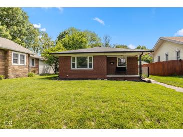 Charming brick home with well-maintained lawn and inviting curb appeal at 4125 Bowman Ave, Indianapolis, IN 46227