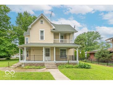 Charming two-story home with a covered front porch, a well-manicured lawn, and mature trees in a desirable neighborhood at 4526 Iowa St, Clayton, IN 46118