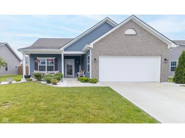 Charming one-story home with blue siding, brick accents, well-kept lawn, and attached two-car garage at 485 Thunderwood Dr, Greenfield, IN 46140