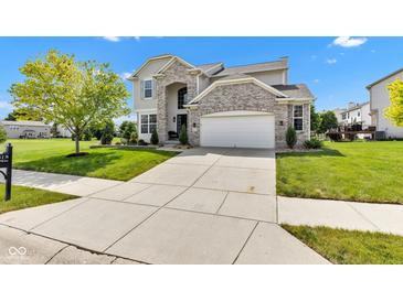 Charming two-story home featuring a brick facade, well-manicured lawn, and a spacious driveway at 515 Lynton Way, Westfield, IN 46074