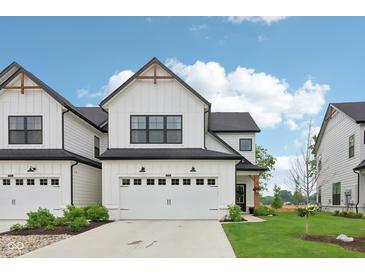 Charming two-story home features a white facade, attached garage, and well-manicured lawn at 17551 Gruner Way, Westfield, IN 46062