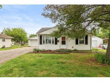 Charming single-story home with a manicured lawn and inviting front porch entrance at 2704 13Th St, Columbus, IN 47201