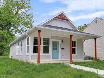Charming home with a modern farmhouse design with a quaint front porch at 4234 Kingsley Dr, Indianapolis, IN 46205