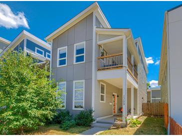 Charming two-story home featuring a cozy front porch and modern architectural details at 1209 Cottage Ave, Indianapolis, IN 46203