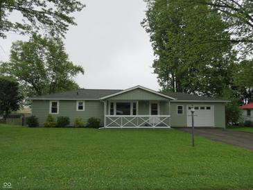 Charming single-story home featuring a well-maintained lawn and inviting front porch at 229 Arnold St, Morgantown, IN 46160