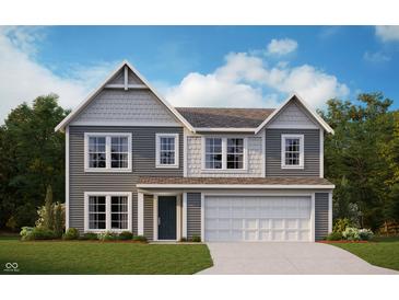 Charming two-story home with gray siding, white trim, and a well-manicured lawn at 741 Oakleaf Dr, Greenfield, IN 46140