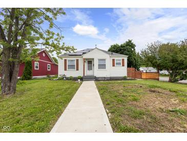 Charming bungalow with a well-maintained lawn and inviting walkway at 2164 E Raymond St, Indianapolis, IN 46203
