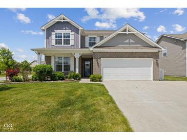 Two-story home with brick and siding, manicured lawn, and attached two-car garage at 632 Albermarle Dr, Pittsboro, IN 46167
