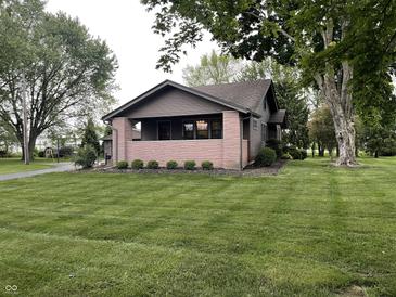 Charming single-story home with a well-maintained lawn and inviting front porch at 9467 N Michigan Rd, Fairland, IN 46126