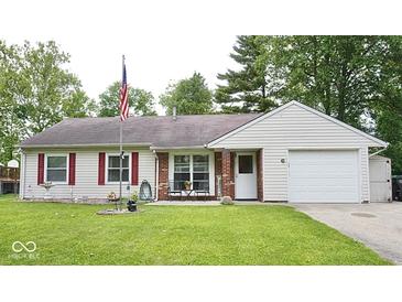 Charming single-story home featuring a well-manicured lawn, red shutters, and a cozy front porch at 254 Bittersweet Dr, Whiteland, IN 46184