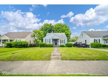 Charming single Gathering home with blue siding, front porch, well maintained lawn, and nice curb appeal at 3004 Sheridan St, Anderson, IN 46016
